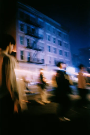 Cinematic Nocturnal Blur style reference image — moody urban night