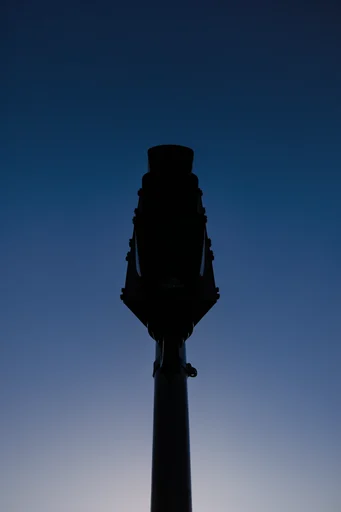 Minimalist Nocturnal Silhouettes style reference image — deep twilight blue palette