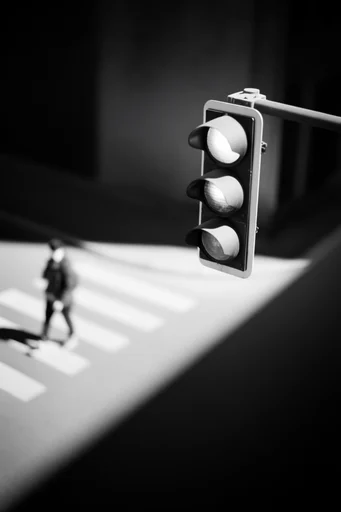 Cinematic Chiaroscuro Noir style reference image — minimalist geometric framing