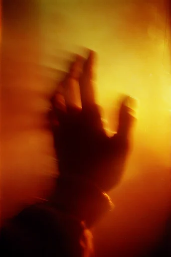 Luminous Amber Silhouette style reference image — fiery orange light
