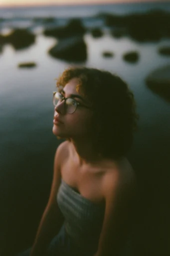 Cinematic Analog Melancholy style reference image — low-key warm lighting