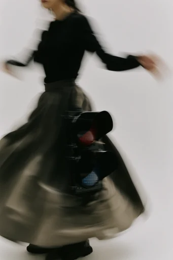 Ethereal Kinetic Minimalism style reference image — shutter drag