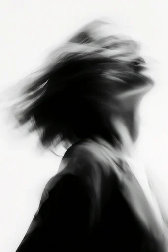 Ethereal Kinetic Monochrome style reference image — grainy film texture