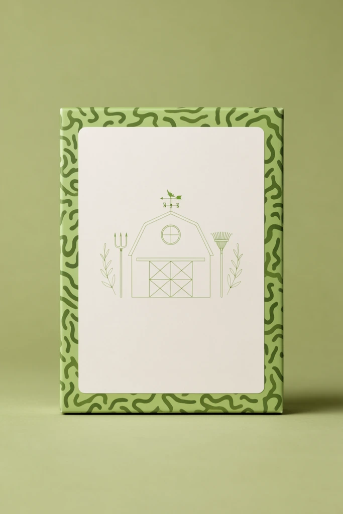Upright rectangular packaging box, seamless matte light olive green backdrop, soft studio lighting with subtle base shadow, thick light green box border patterned with abstract dark green organic squiggles, large off-white central panel, delicate thin-line symmetrical light green illustration, geometric barn structure with circular window motif, flanking pitchfork and rake, weather vane symbol, botanical sprigs, minimalist clean composition, straight-on flat perspective