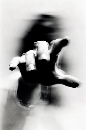 Ethereal Monochrome Motion style reference image — heavy analog film grain