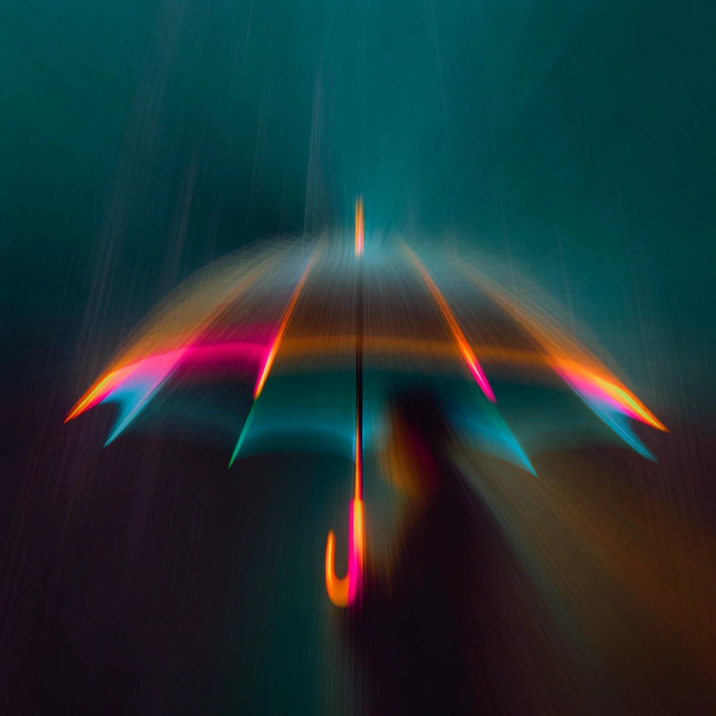 an open umbrella and falling rain captured via long-exposure zoom burst, gentle spring text at the base, subjects abstracted into vibrant kinetic light trails, neon magenta and electric orange streaks slicing through a deep teal atmosphere, central vanishing point, intentional camera movement, light-painted textures, high-speed motion blur, glowing silhouettes, ethereal rain droplets as linear trajectories, hyper-kinetic energy, minimalist composition