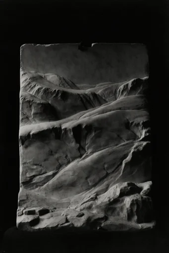 Monochrome Geometric Chiaroscuro style reference image — stark black background