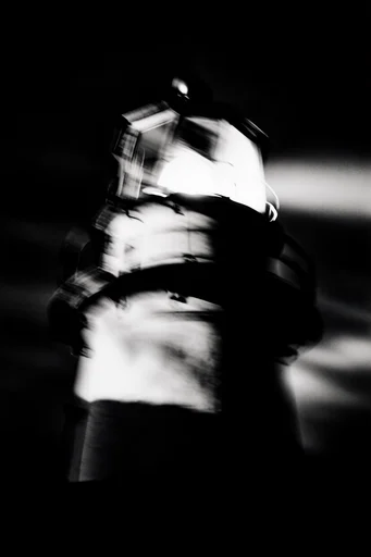 Spectral Industrial Noir style reference image — shutter drag