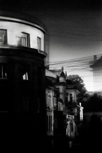 Surreal Noir Grain style reference image — heavy film grain