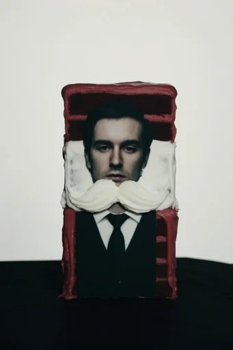 Surrealist Minimalist Avant-Garde style reference image — theatrical minimalism