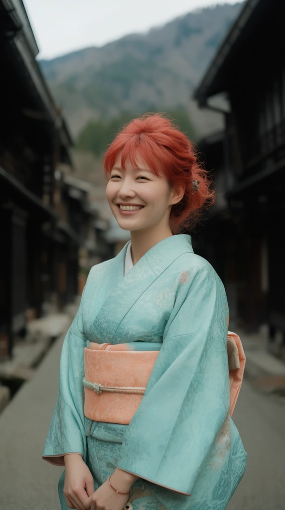 smiling woman in light teal kimono with peach obi, red hair tied up, traditional dark wooden street, blurred mountain background, soft daylight, shallow focus
