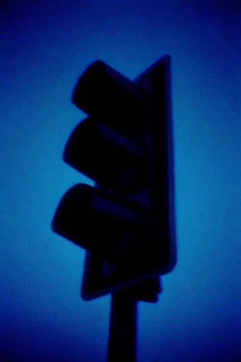 Nocturnal Liminal Noir style reference image — heavy analogue film grain