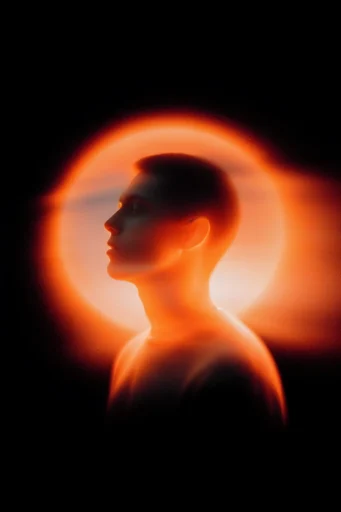 Crimson Solar Noir style reference image — high-contrast backlighting