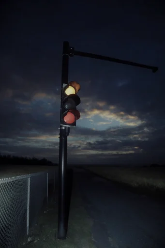 Cinematic Nocturnal Liminality style reference image — soft urban bokeh
