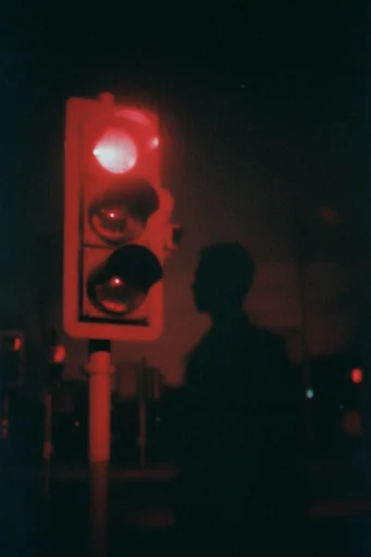 Nocturnal Crimson Noir style reference image — glowing crimson light