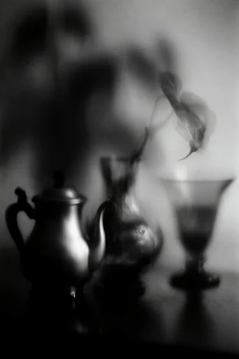 Ethereal Noir Motion style reference image — heavy film grain