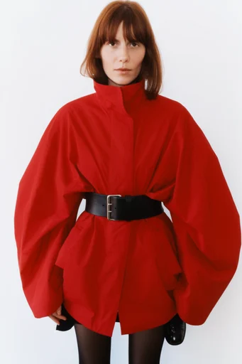 Structured Minimalist Avant-Garde style reference image — deconstructed silhouettes