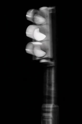 Kinetic Spectral Monochrome style reference image — motion blur portraiture