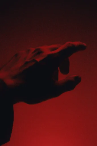 Crimson Noir Cinema style reference image — heavy analog film grain