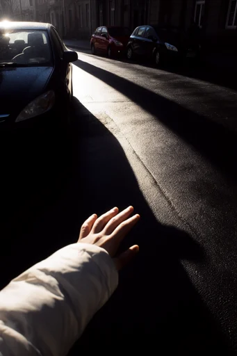 Cinematic Urban Chiaroscuro style reference image — dramatic shafts of light