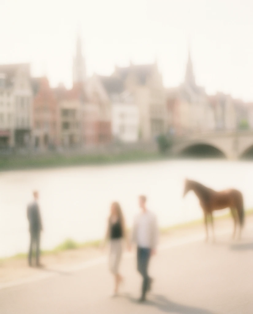 An ethereal, extreme soft-focus composition of a river flowing horizontally through the center, dividing a hazy background cityscape from a paved foreground walkway. Characterized entirely by heavy lens blur, smooth gradients, and luminous diffused lighting, the scene features a low-contrast, overexposed color palette of pale creams, warm whites, and faded reddish-browns. On the foreground walkway, the heavily blurred forms of a man and a woman walk together toward the right, appearing as soft, indistinct silhouettes. A single man stands on the left edge, and a horse stands on the right side of the path, all of their shapes melting into the bright, hazy atmosphere. The smooth, pale band of the river separates the foreground from the distant riverbank, where a cluster of numerous buildings with varying shapes and tall vertical spires dissolves into the creamy, airy background. On the far right, an arched bridge spans the water, its curved structure softly defined within the grainy, dreamlike, completely out-of-focus environment.