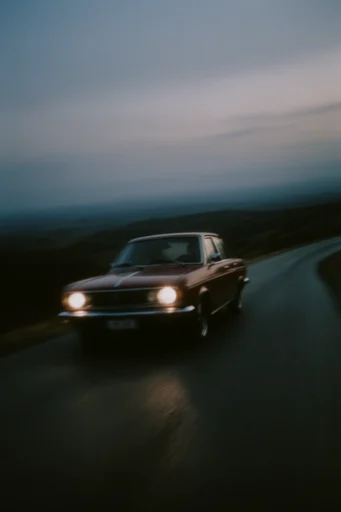 Cinematic Twilight Solitude style reference image — warm headlight glow