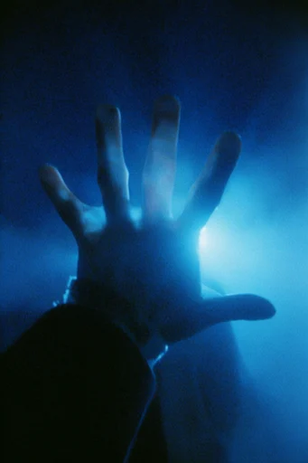 Nocturnal Cyan Noir style reference image — grainy analog film texture