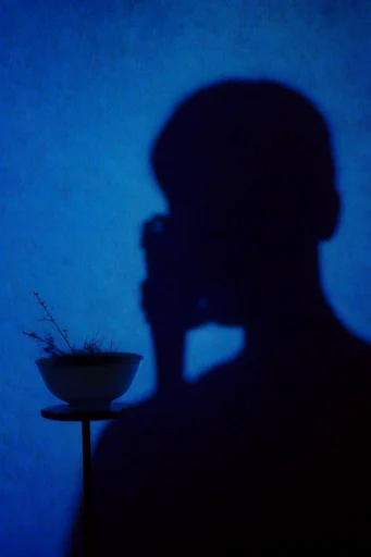 Nocturnal Liminal Noir style reference image — heavy analogue film grain