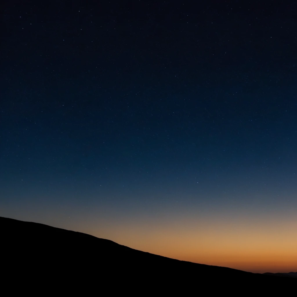 A starry night sky transitions into a warm amber twilight glow above a stark black mountain silhouette. The deep navy blue expanse is speckled with faint stars, fading downward into a smooth gradient of lighter blue and orange at the horizon. A solid black sloping hill anchors the bottom left, creating a minimalist, high-contrast landscape scene.