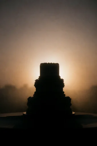 Luminous Amber Silhouette style reference image — dramatic sunset lighting