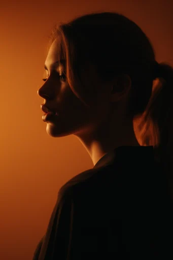 Cinematic Amber Chiaroscuro style reference image — high-contrast shadows