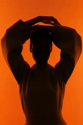 Amber Chiaroscuro Minimalism style reference image — saturated warm gradient