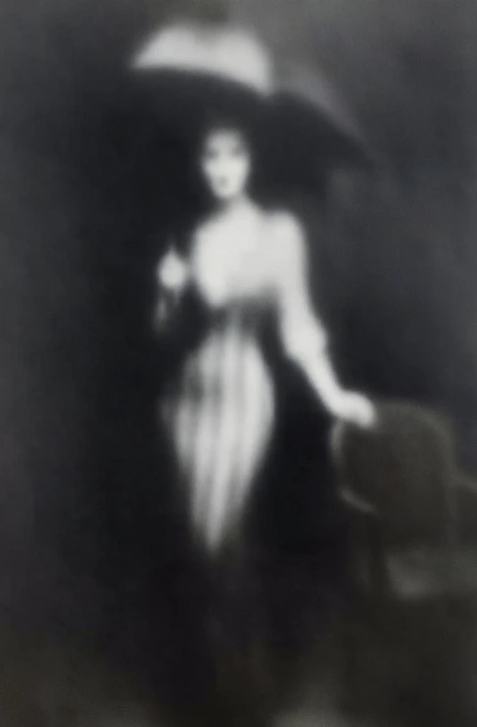 a woman standing centrally in a long striped dress, holding an umbrella, one hand resting on a chair to the right, rendered in a heavily blurred and ethereal black and white aesthetic, high-contrast dreamlike lighting, glowing soft highlights against deep shadows, grainy film texture, mysterious and painterly mood, avant-garde fashion photography style, soft focus obscuring sharp details, cinematic noir composition, hauntingly beautiful monochromatic palette.
