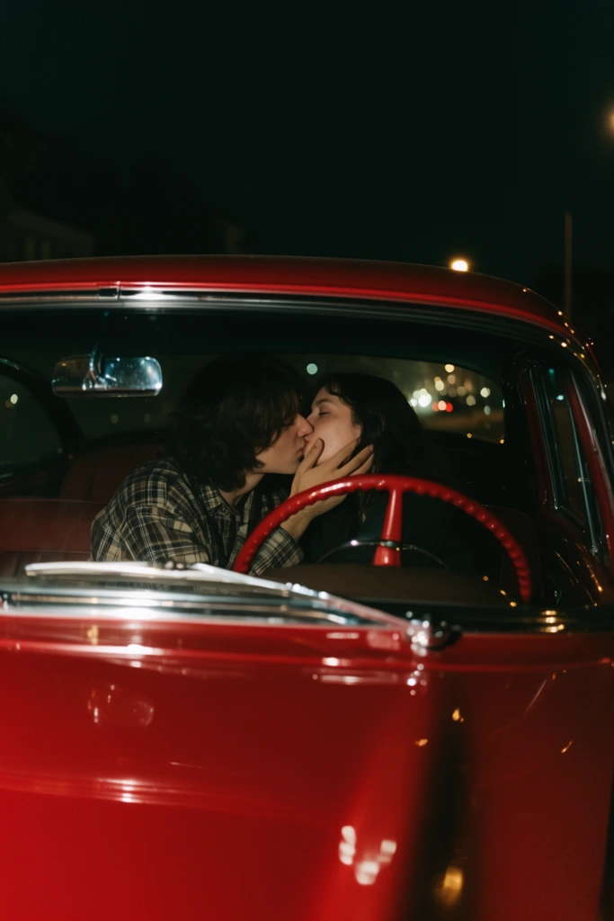 couple kissing inside a vintage red car at night, framed through the front windshield, glossy cherry red hood in the foreground, chrome wipers, red steering wheel, person on left in a plaid shirt, person on right holding their partner's face, dimly lit interior, dark background with distant glowing bokeh streetlights, cinematic wide shot, low-key lighting, reflective surfaces, 35mm film aesthetic