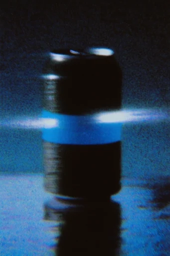 Luminous Spectral Noir style reference image — heavy analog film grain