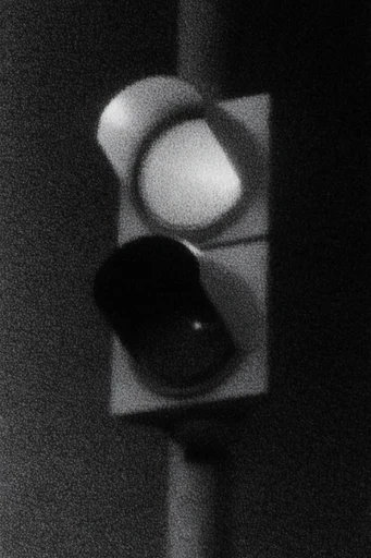 Gritty Liminal Noir style reference image — chiaroscuro lighting
