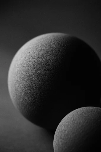 Cinematic Noir Minimalism style reference image — heavy film grain