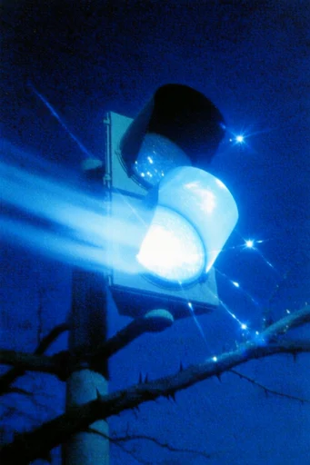Electric Nocturnal Surrealism style reference image — heavy film grain