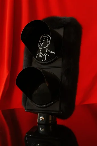 Crimson Noir Minimalism style reference image — obsidian black subject
