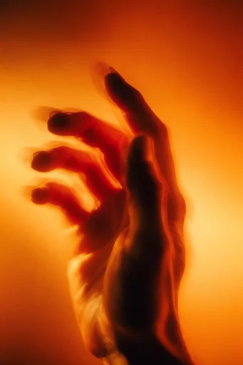 Luminous Amber Silhouette style reference image — amber and red gradient