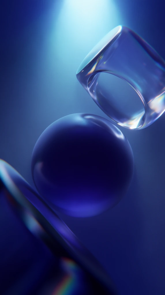 abstract floating geometric shapes in a deep blue void, smooth central sphere, hollow transparent cylinder angled above, blurred edge in lower left, monochromatic deep indigo to bright cyan palette, volumetric top-down spotlight, glowing highlights on polished glass textures, shallow depth of field, subtle chromatic aberration, ethereal atmospheric fog