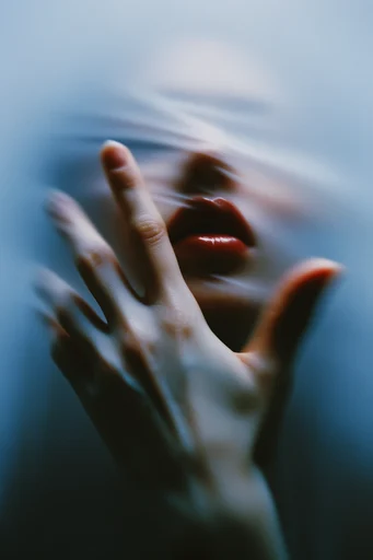 Tactile Gloss Distortion style reference image — high-contrast studio lighting
