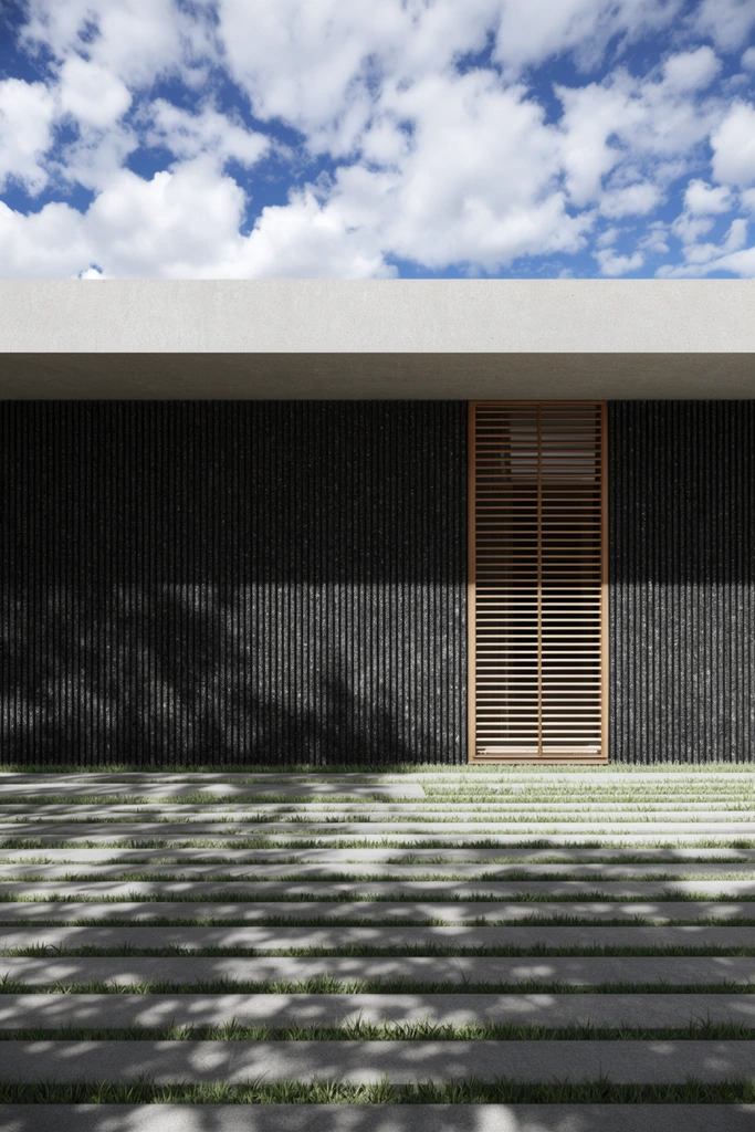 Modern minimalist facade, light gray concrete overhang, dark textured wall with vertical fins, wooden louvered window, linear paving stones with grass strips, dappled foliage shadows, blue sky with cumulus clouds, photorealistic architectural rendering, high contrast lighting