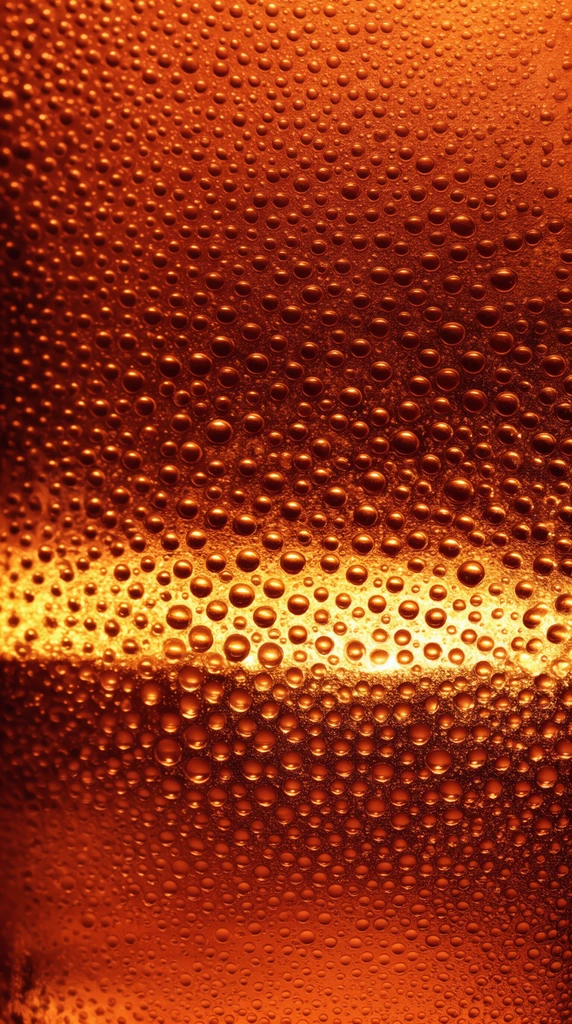 Macro photography of condensation on glowing amber glass, thousands of tiny spherical water beads varying in size on a smooth curved surface, horizontal luminous golden band across the mid-section, rich orange and deep brown color palette, high contrast backlighting, bright specular highlights on individual drops, abstract texture filling the frame, crisp focus