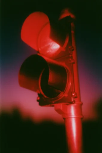 Crimson Analog Noir style reference image — heavy analog film grain