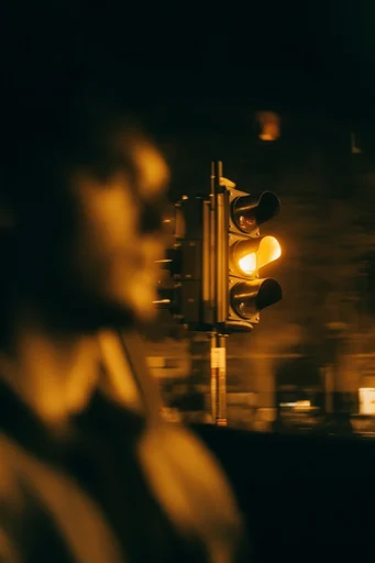 Cinematic Amber Nocturne style reference image — high contrast shadows