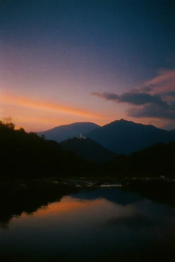 Nostalgic Liminal Twilight style reference image — heavy film grain