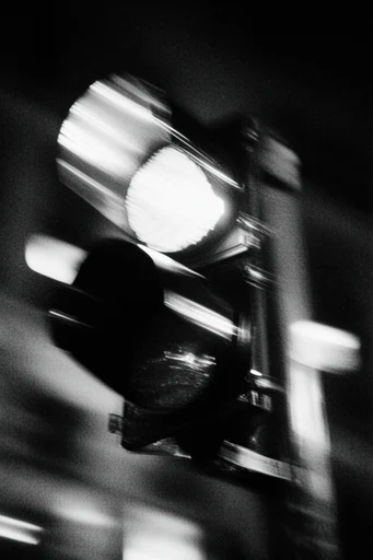 Kinetic Noir Abstraction style reference image — heavy film grain