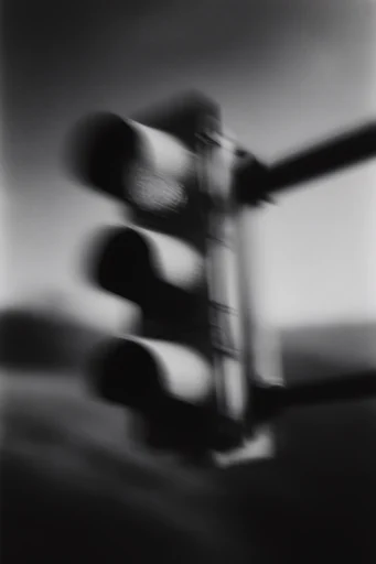 Ethereal Noir Motion style reference image — heavy film grain
