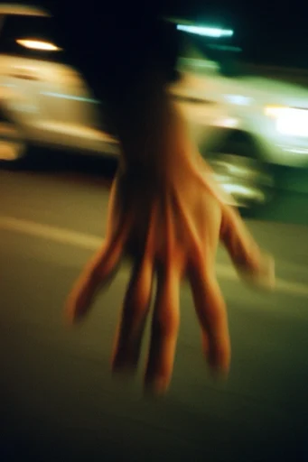 Kinetic Nocturnal Haze style reference image — amber light trails